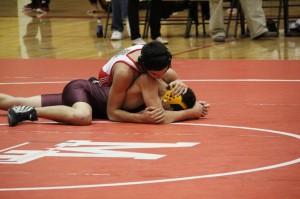 Sophomore Kevin Massey pins a Lakewood opponent on Wednesday Dec. 5. 