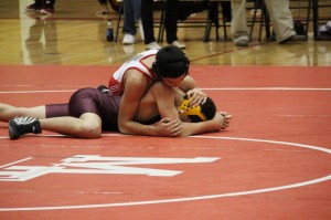 Sophomore Kevin Massey pins a Lakewood opponent on Wednesday Dec. 5.