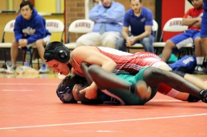 The Hawks' Kevin Massey (top) pins Shorewood's Dawda Dibba with 5 seconds to go in the match Thursday night in the Terraceum. Massey's pin in the 145 pound weight class tied up the match between the T-Birds and Hawks with one more match to go. 