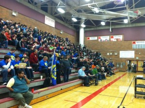 Robotics students and parents prepare to watch this year's FRC FIRST Robotics instructional video. After watching the video, teams got to work planning robot design and began building the first parts of their robots (Photo courtesy of Daylan Kelting).